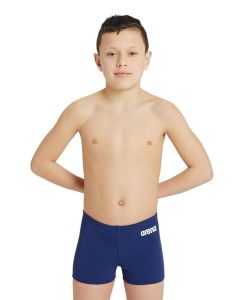 Front view of boy wearing Arena Boy's Team Solid Swim Shorts - Navy/White